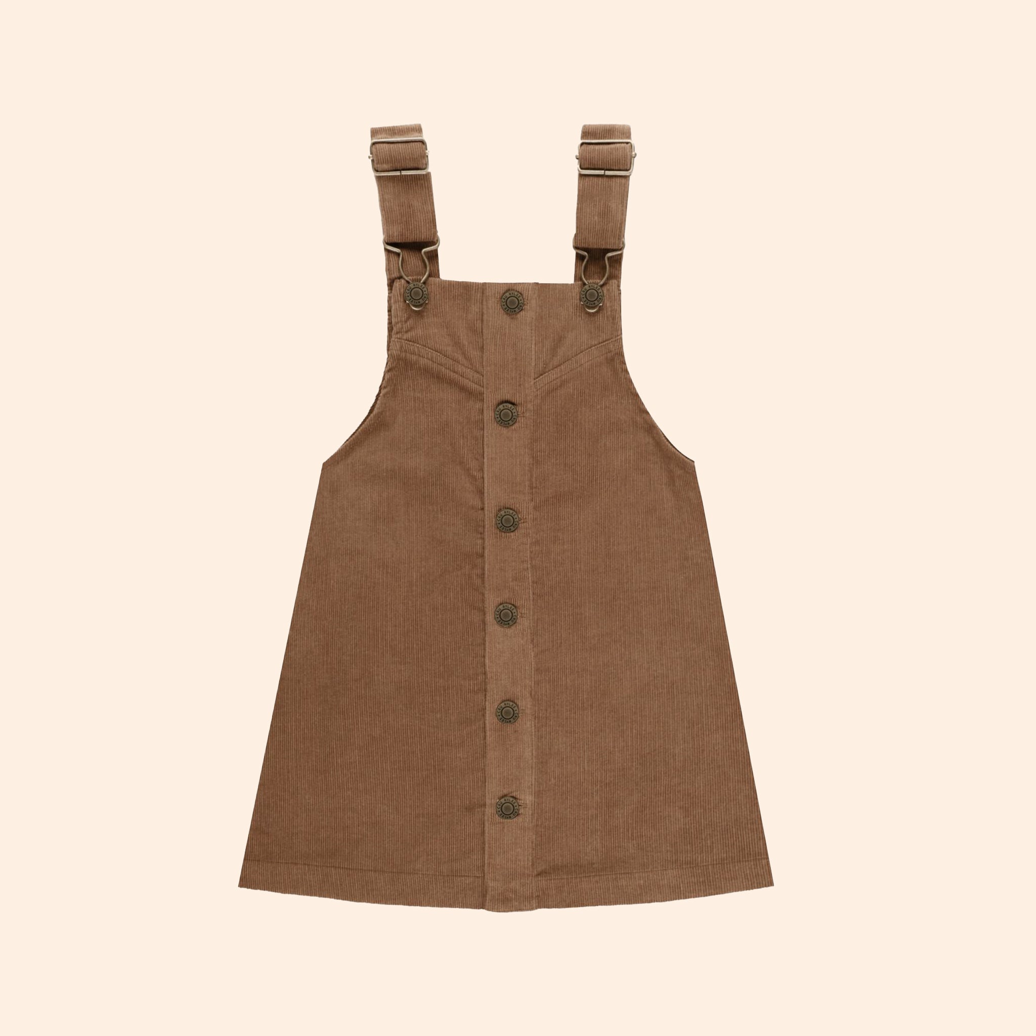 A children's sized brown overall dress with buttons up the front and button shoulder straps. 