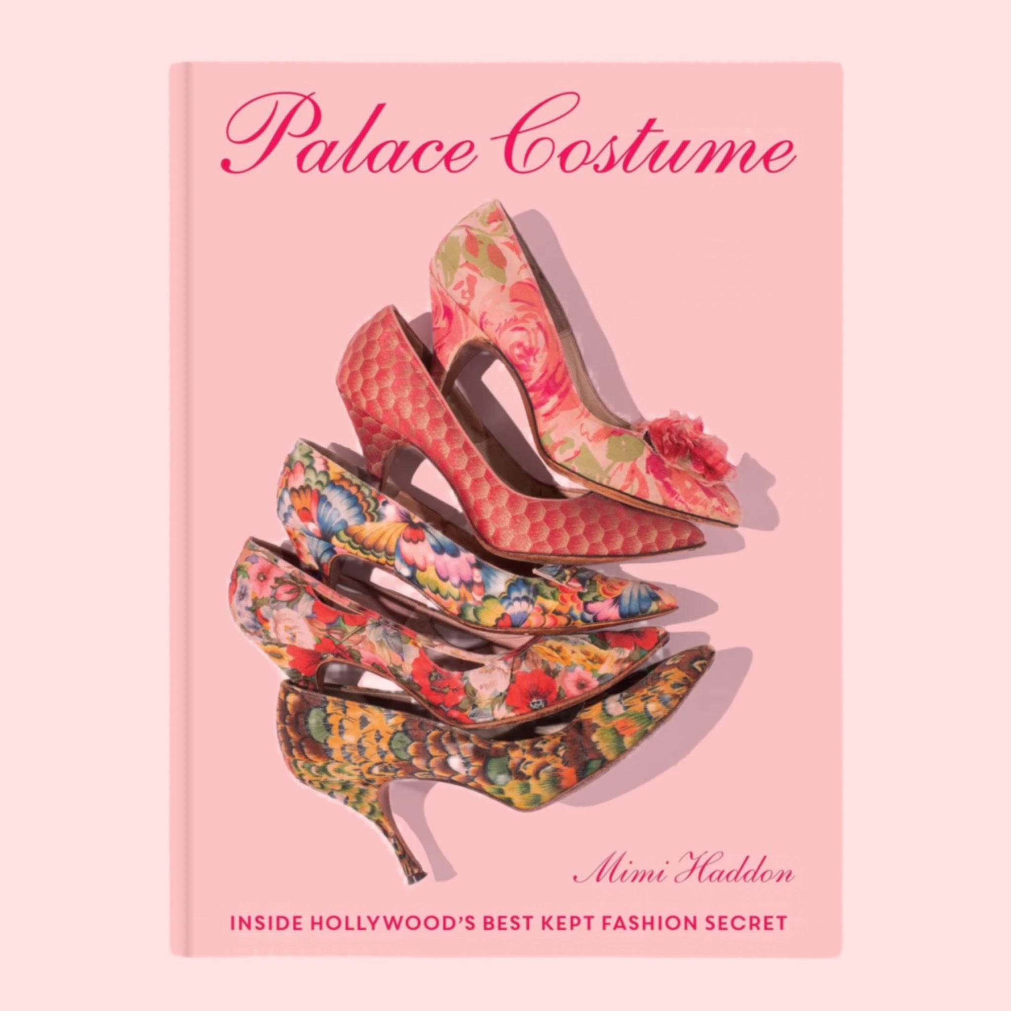 A cook cover with a photo of high heels and pink text that reads, 'Palace Costume'. 