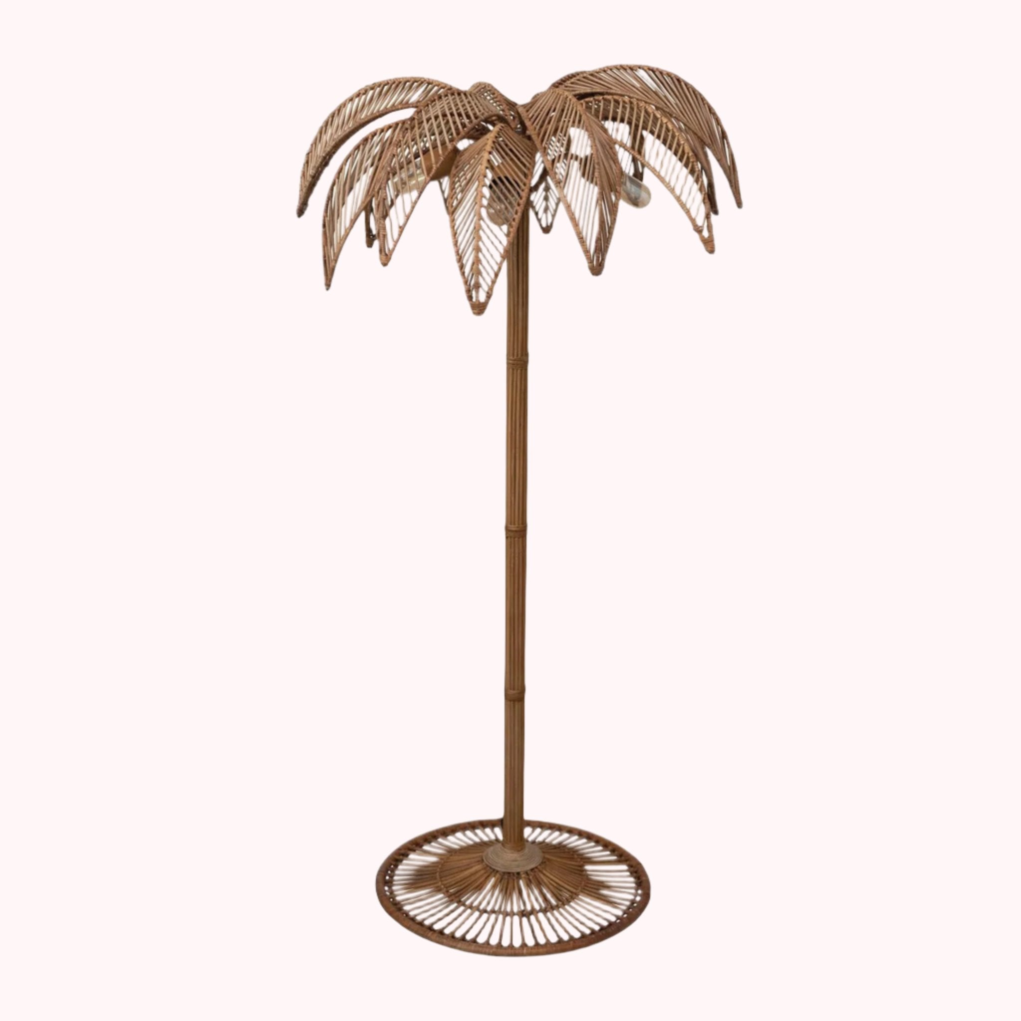 A brownish bronze metal palm tree shaped floor lamp. 