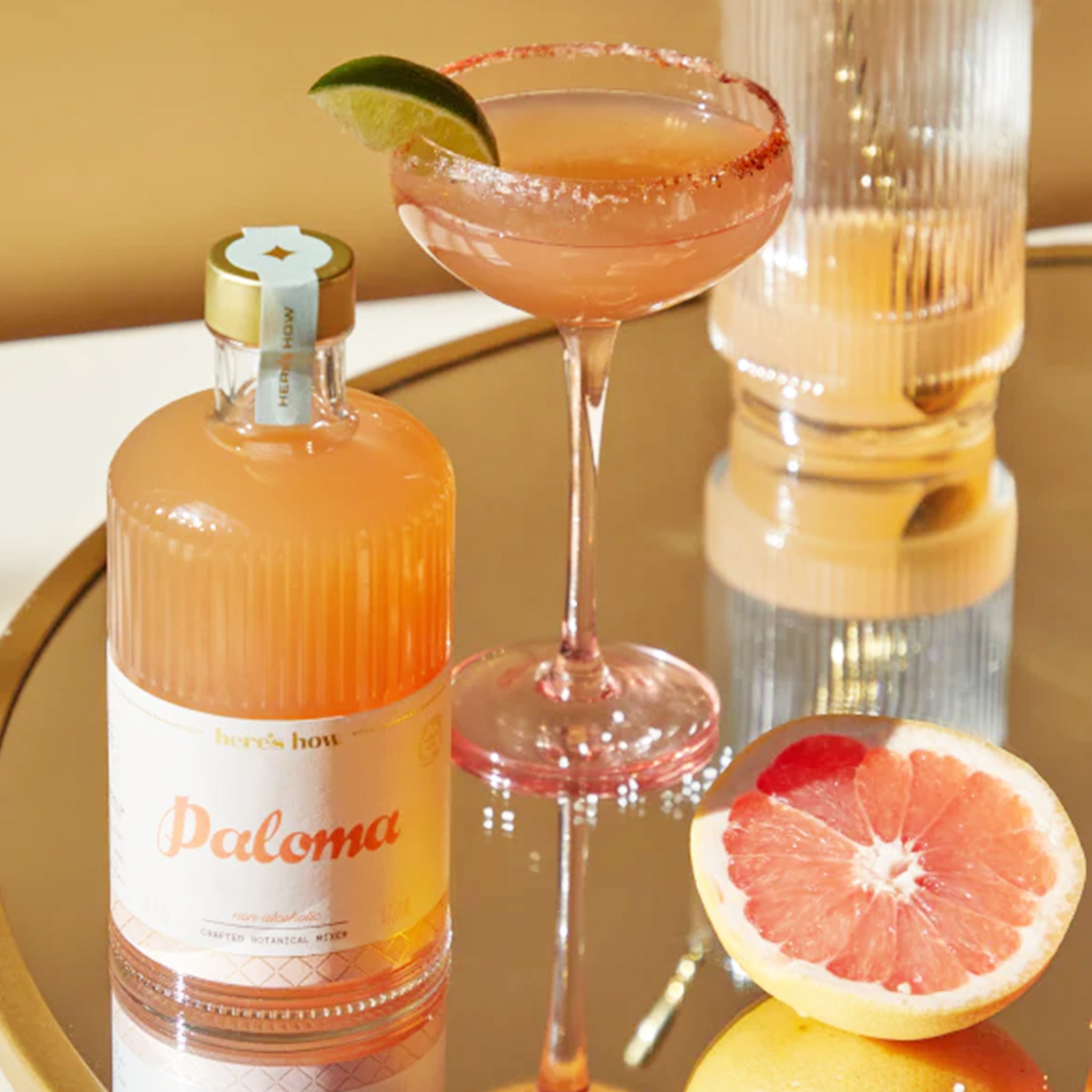 A glass bottle with Paloma cocktail mix.