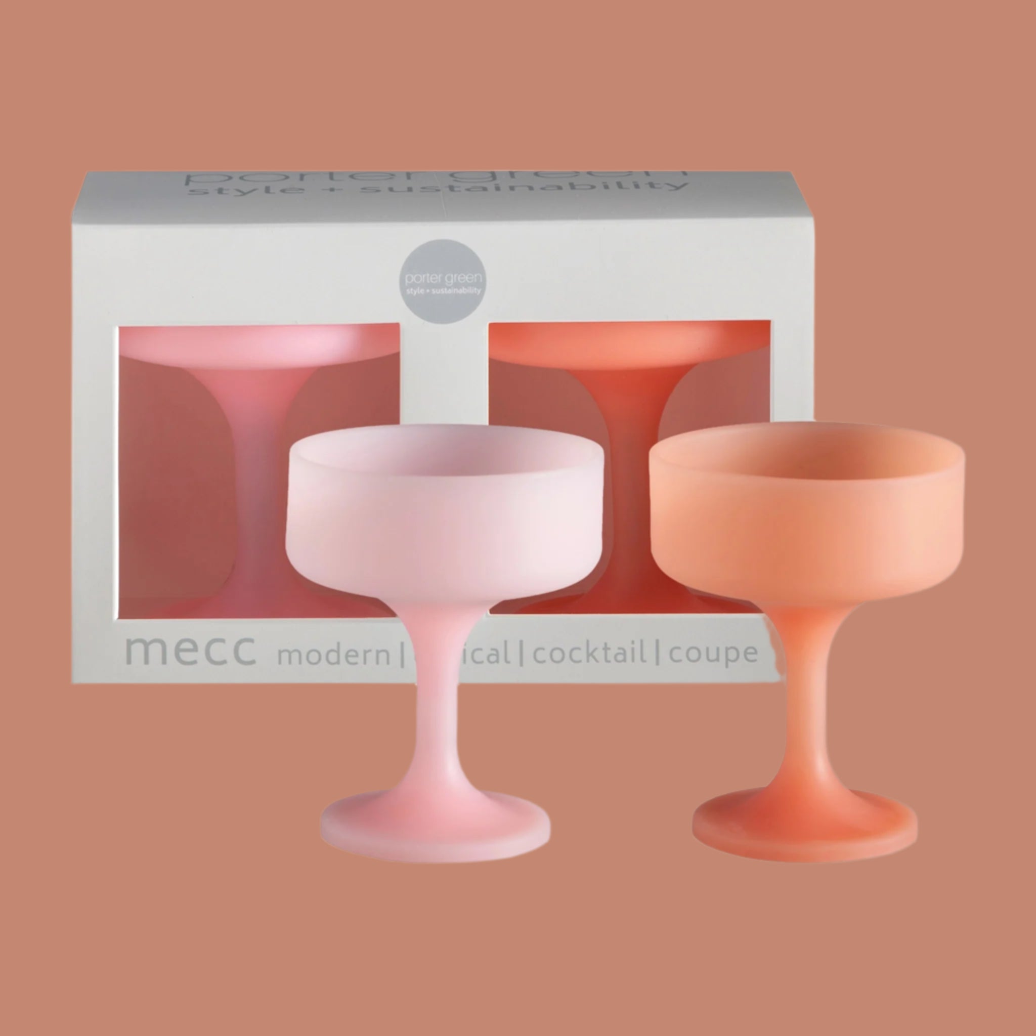 A pair of peachy and pink silicone coupe shaped cocktail glasses.