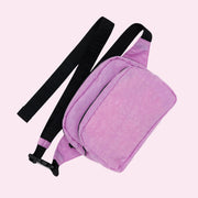 A bright pink and black fanny pack with an adjustable strap.