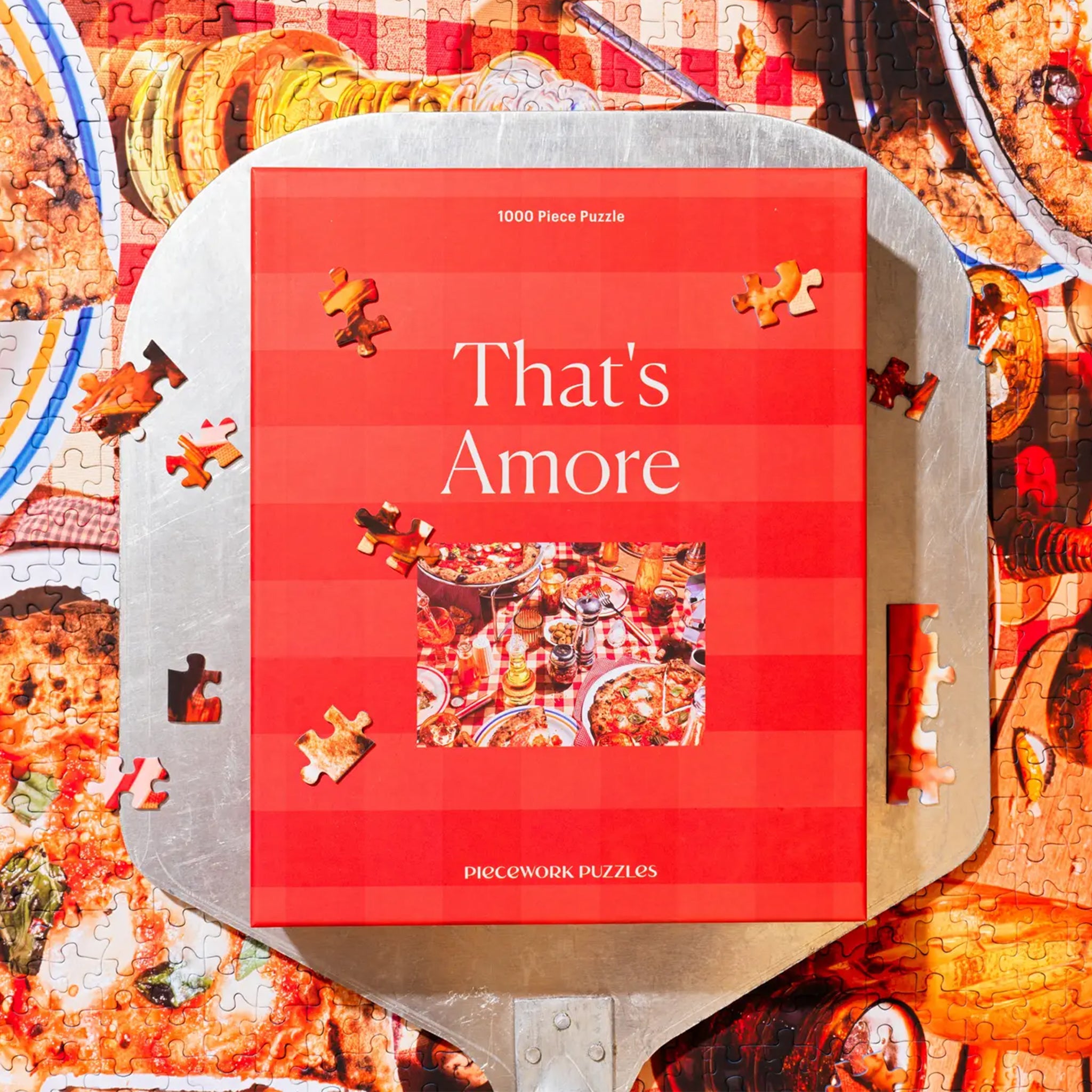 A pizza themed red puzzle in a red box that reads, &#39;That&#39;s Amore&#39;.