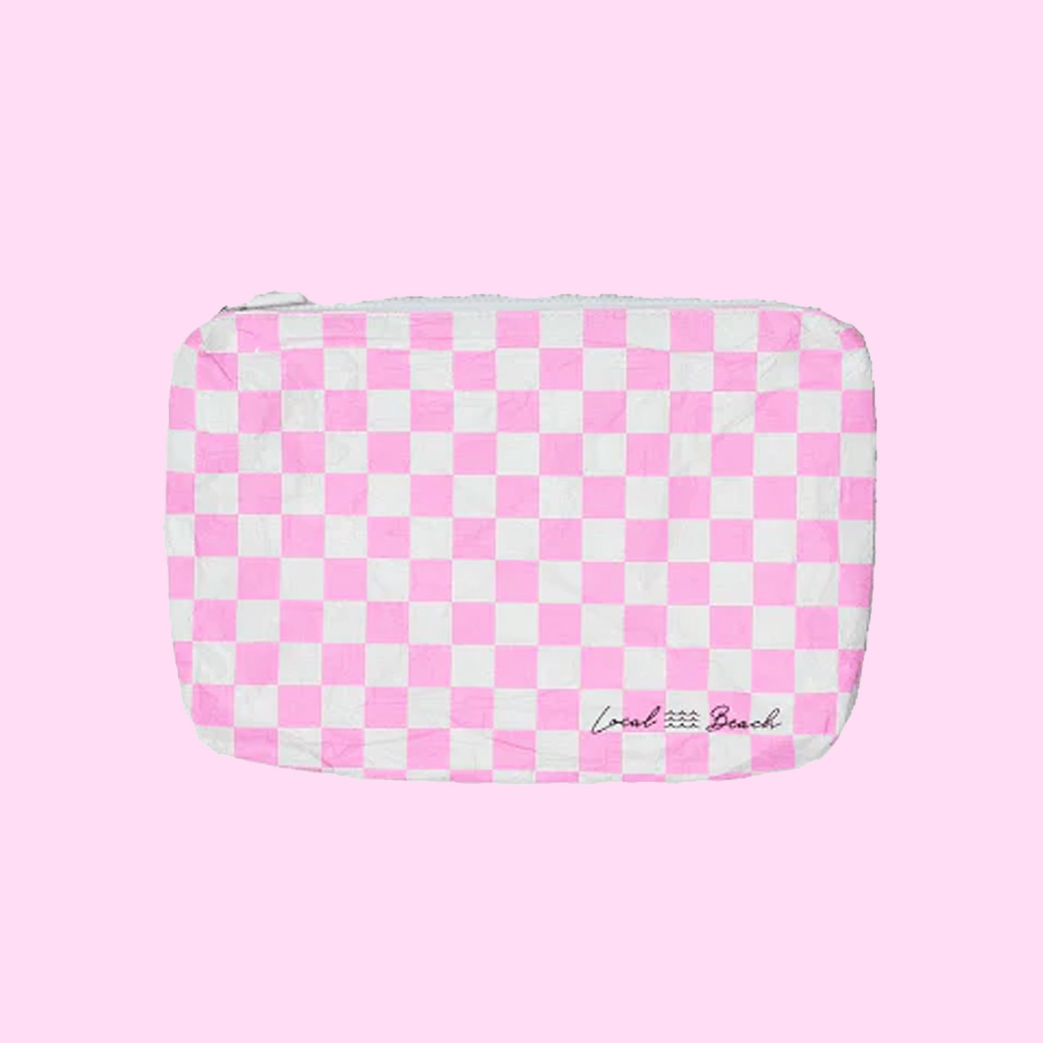 ON a pink background is a pink and white checkered pouch. 