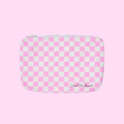 ON a pink background is a pink and white checkered pouch. 