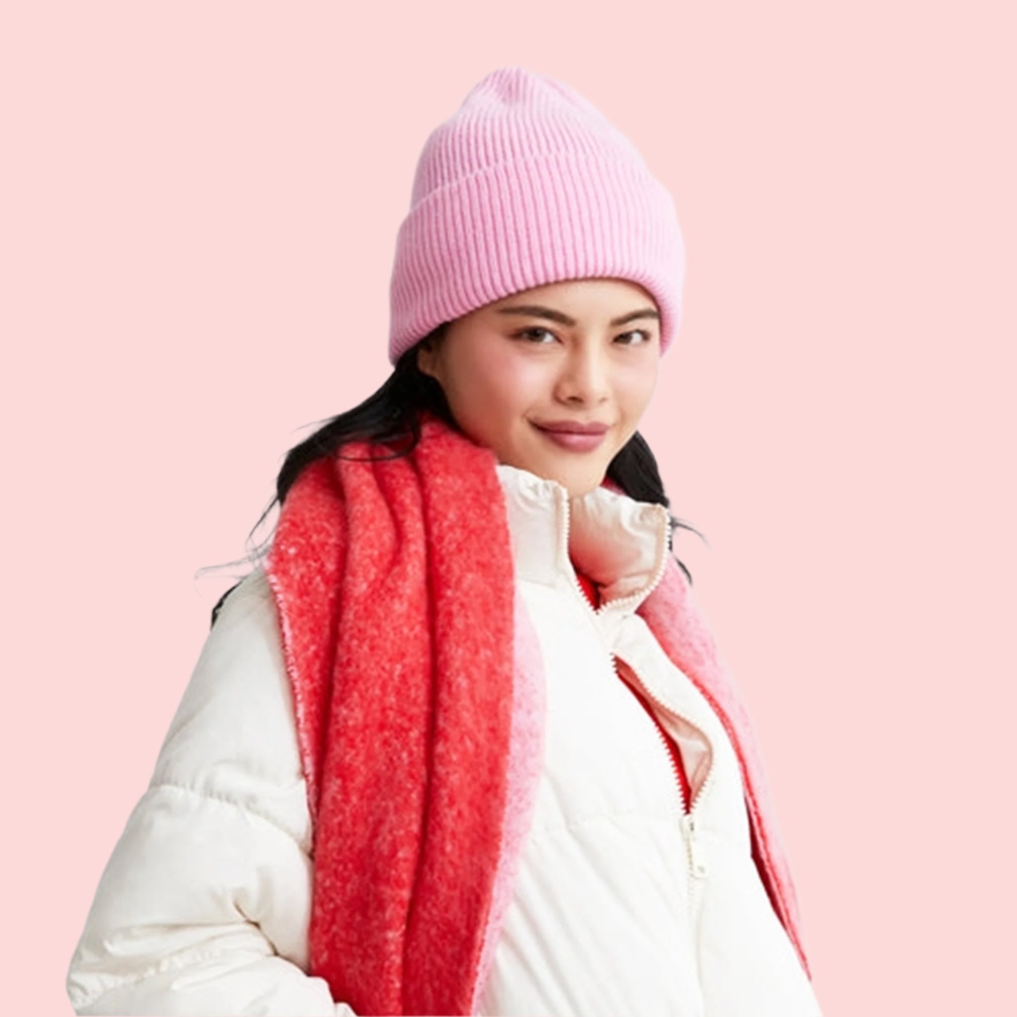 A pink knit beanie. 