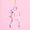 On a pink background is a light pink retro deer ornament with white details and spots and a gold bell on the front of its neck along with a gold string loop for hanging.