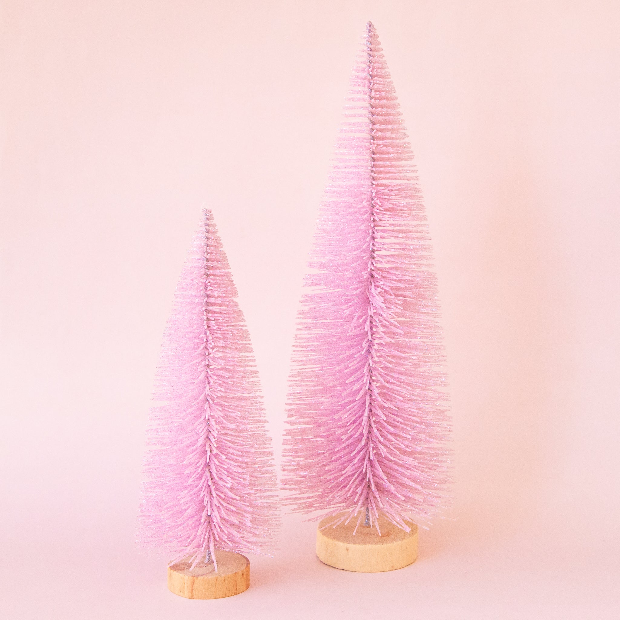 Two pink bottle brush trees in. Each sold separately.