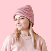 A dusty rose knit beanie. 