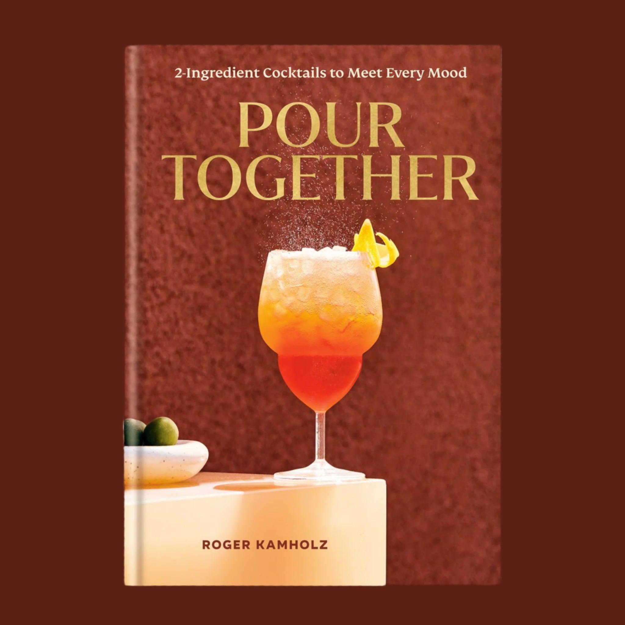 A brick red book cover with a sparkling beverage and the title with text that reads, 'Pour Together'. 