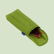 A green puffy eyeglass sleeve. 