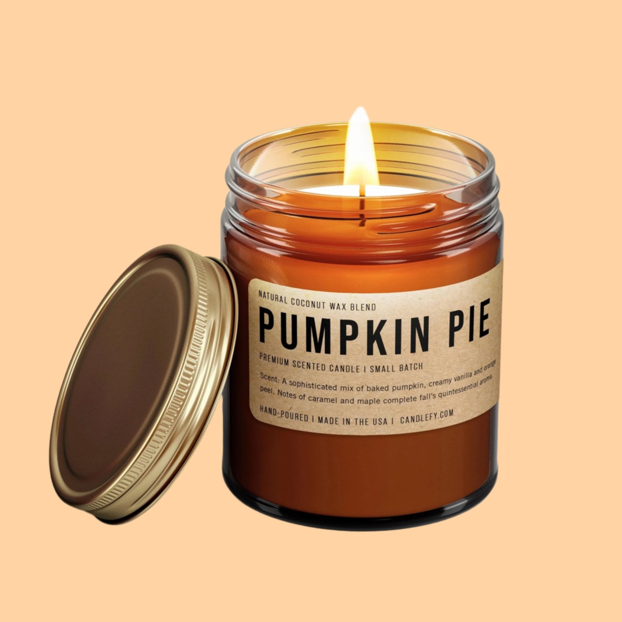 A brown glass jar with a label that reads, &#39;Pumpkin Pie&#39; and a gold lid. 