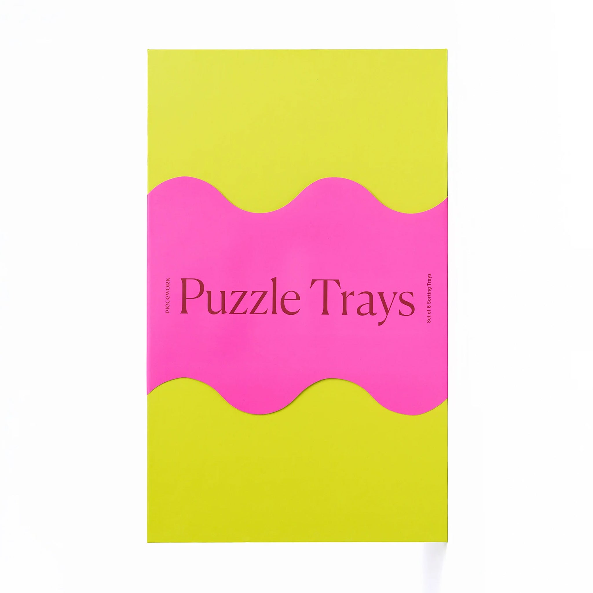 A set of 6 trays in vibrant colors for sorting through puzzle pieces. Puzzle sold separately. 