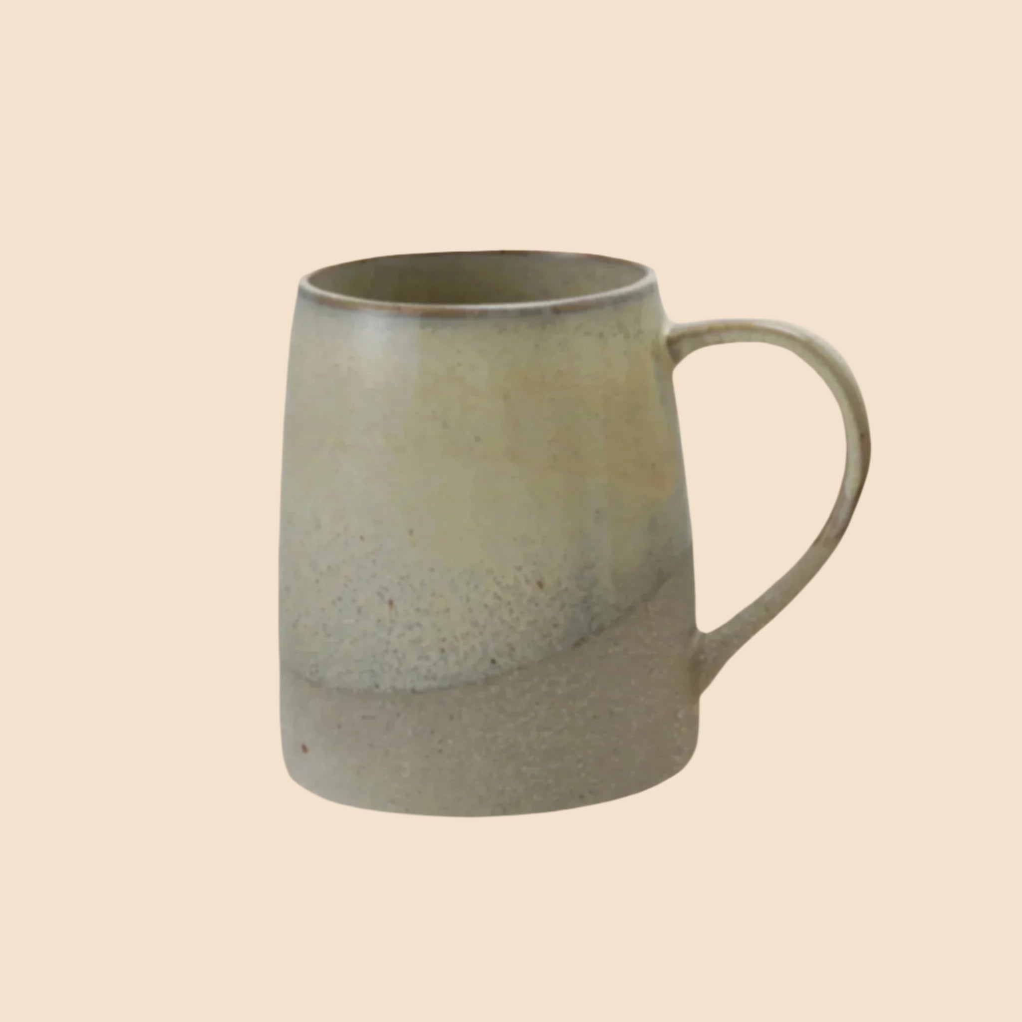 A ceramic mug with a reactive glaze grey finish. 