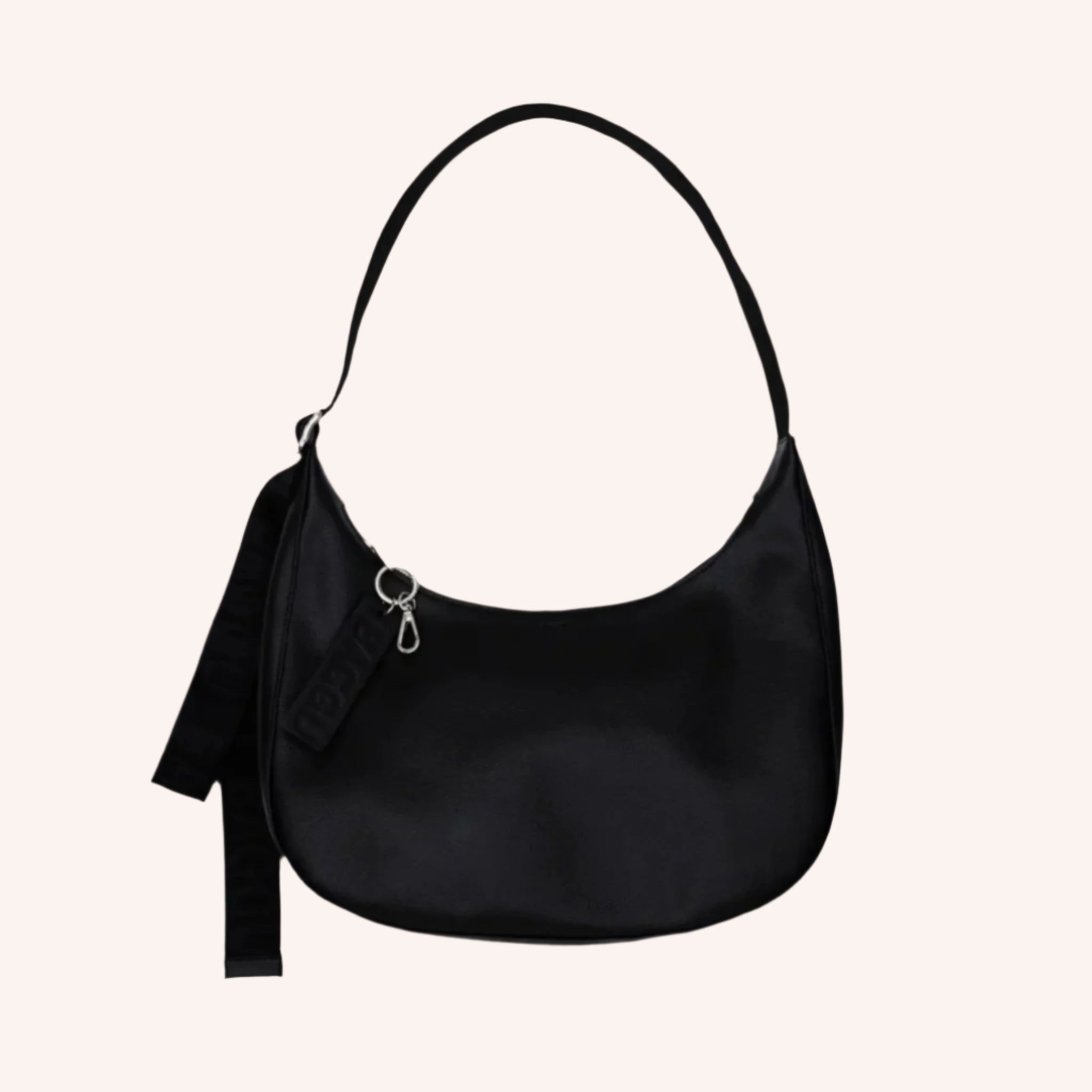 A recycled leather crescent bag shaped handbag. 