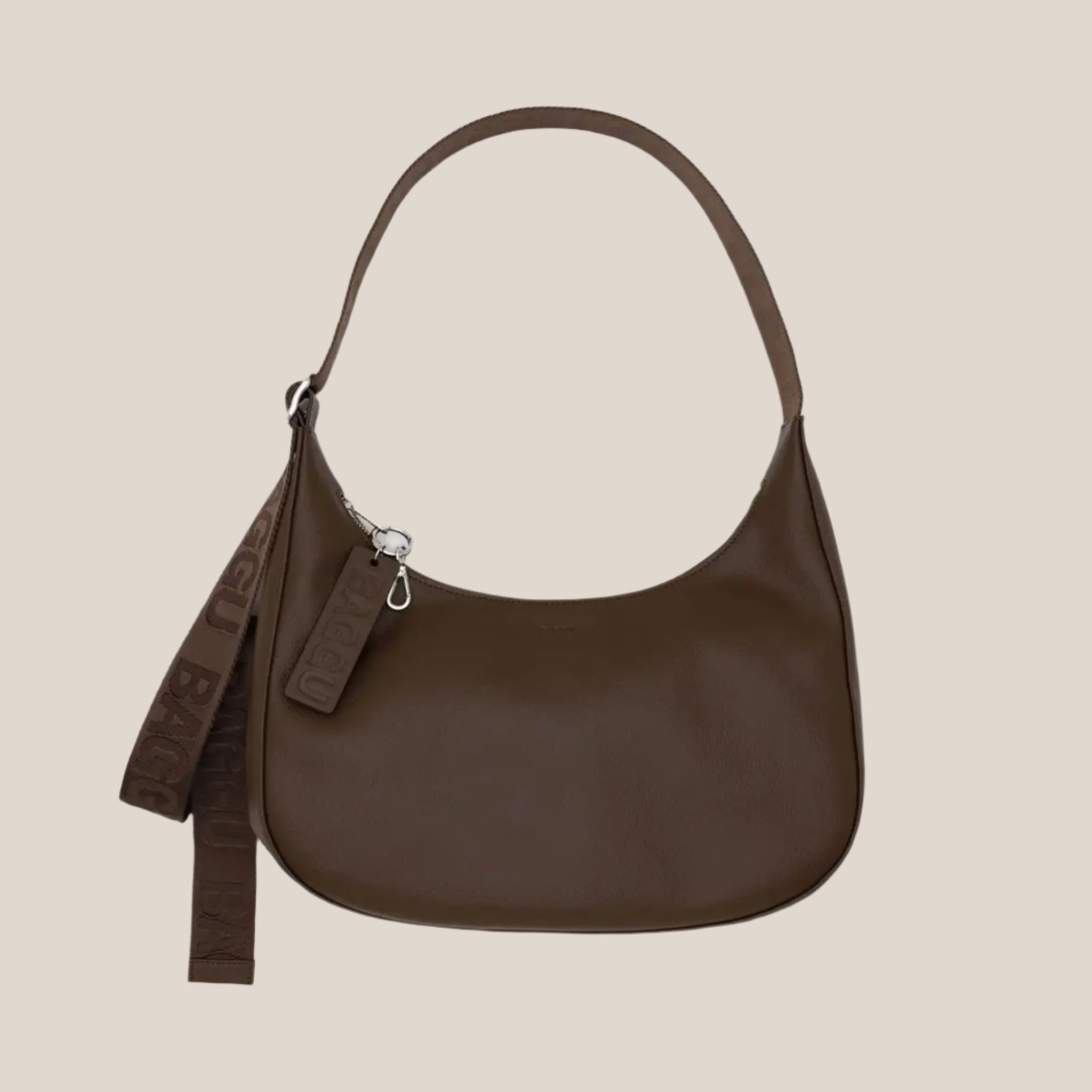 A brown leather crescent bag. 