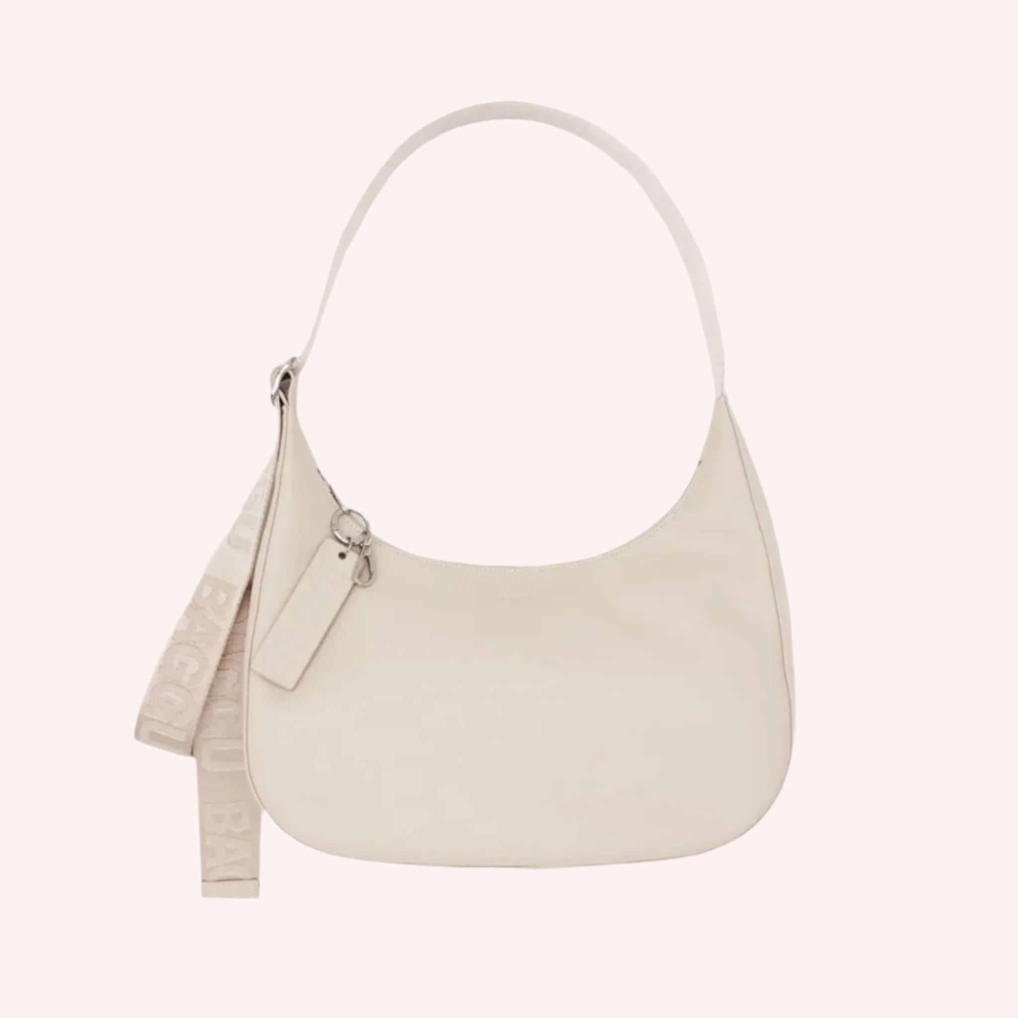 A neutral leather shoulder bag in an off white cream shade. 