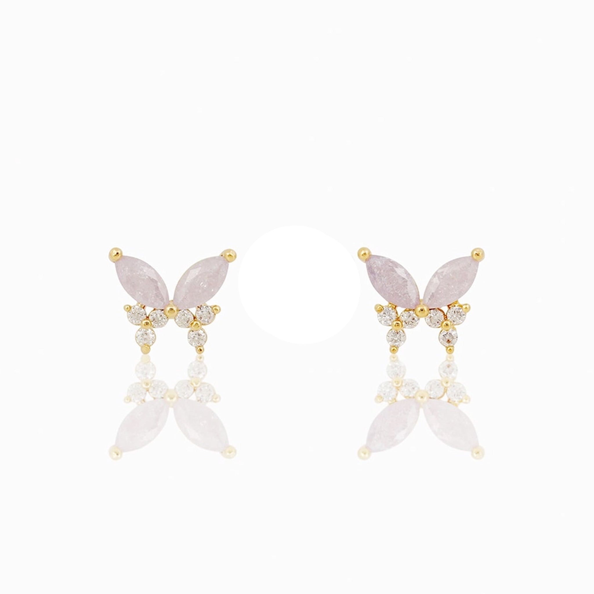 A pair of lavender and clear cz stud earrings in the shape of a butterfly. 