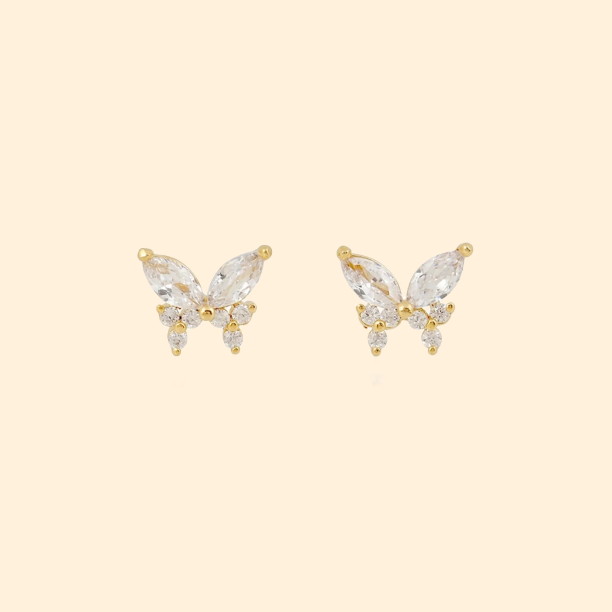 A pair of butterfly shaped stud earrings made out of different shaped cz stones. 