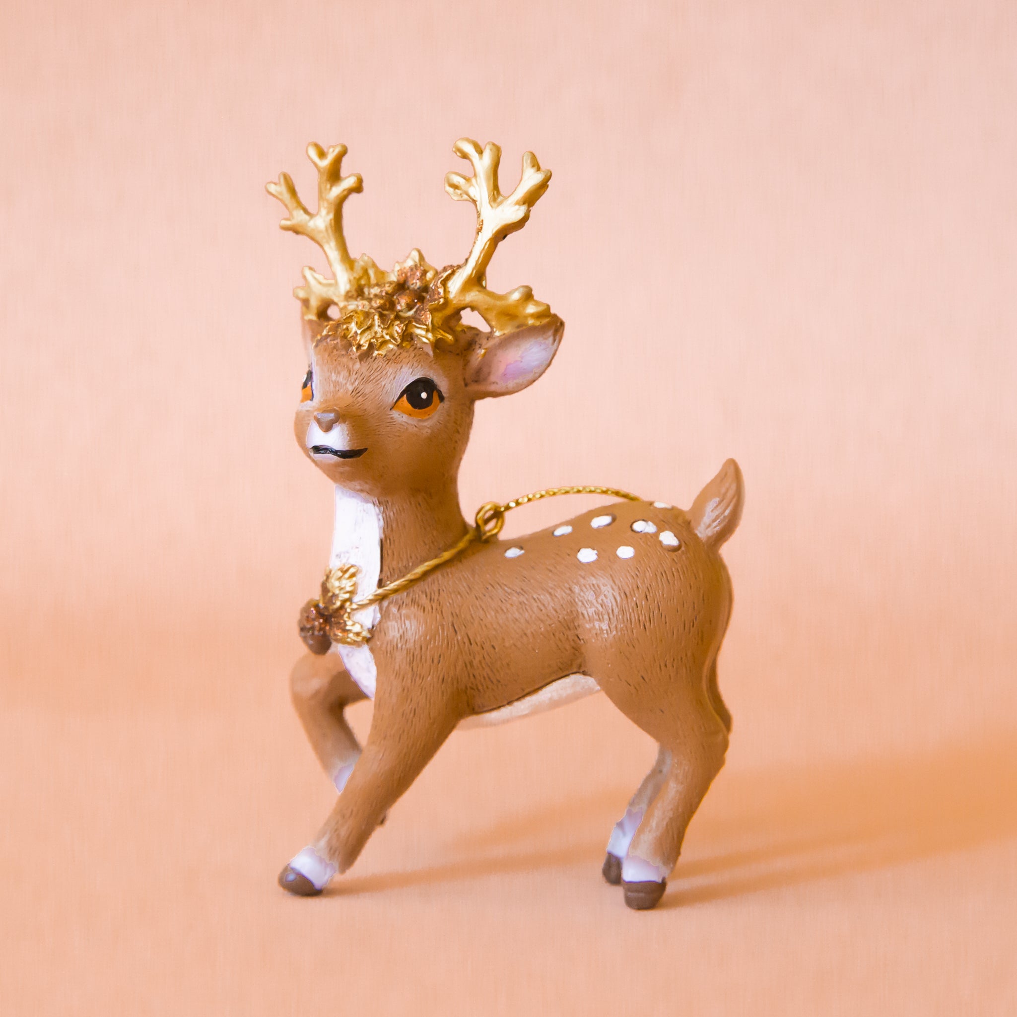 A brown ornament in the shape of a reindeer. 