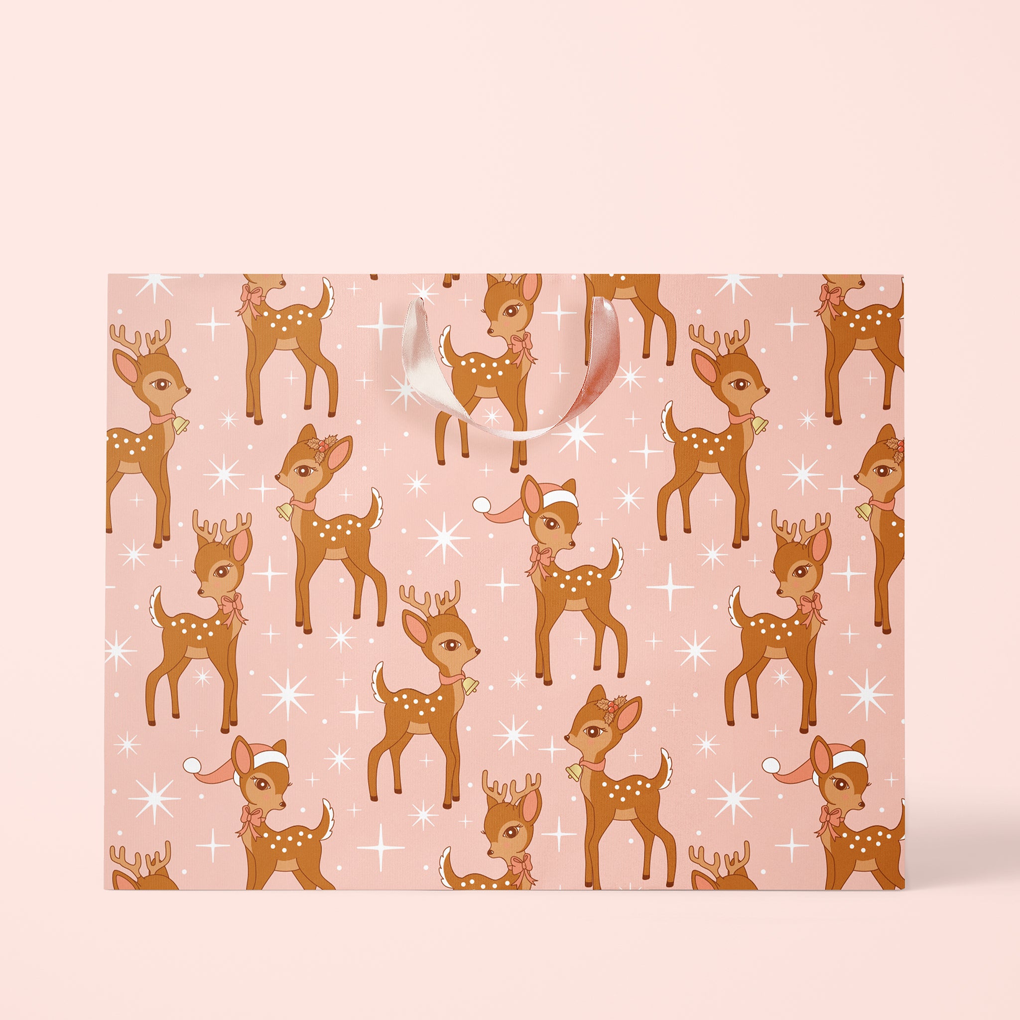 On a pink background is a pink and brown retro deer print gift bag.