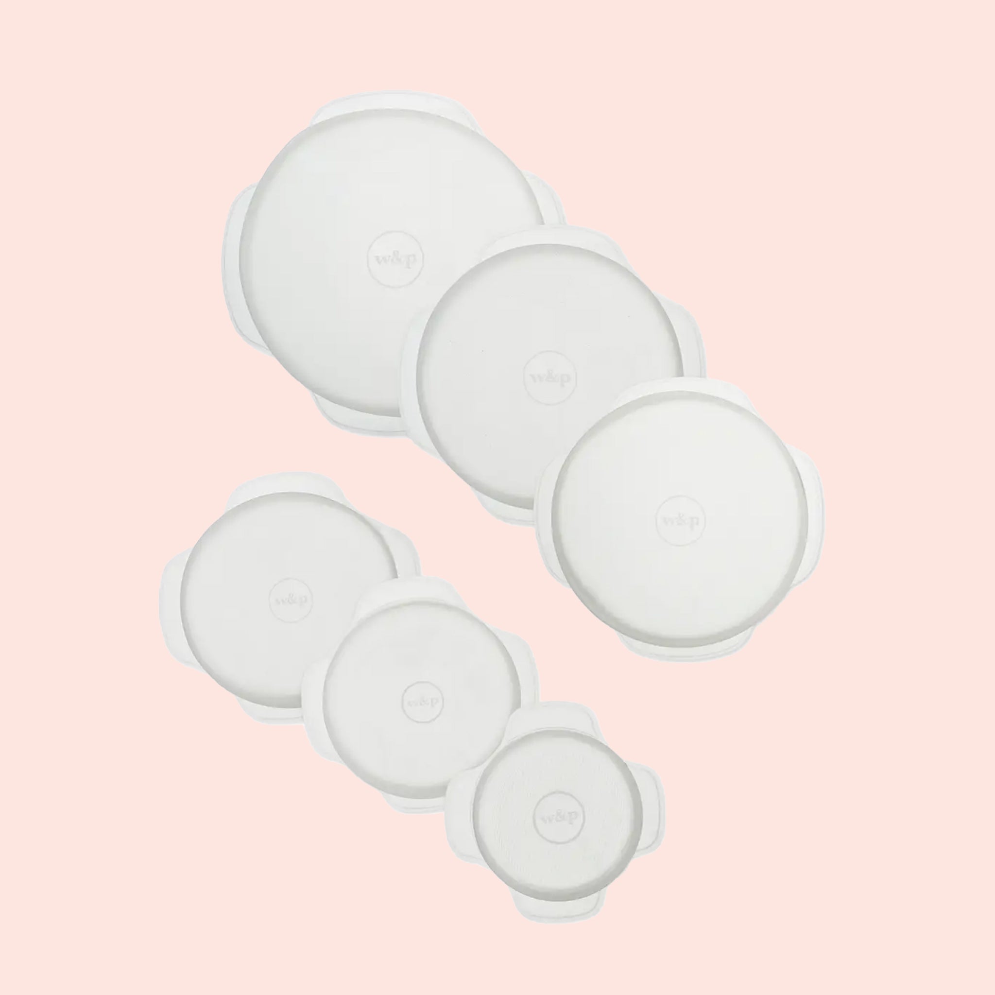 A set of six, round silicone stretch lids for storing food in the kitchen. Glasses used for the photo not included with purchase.