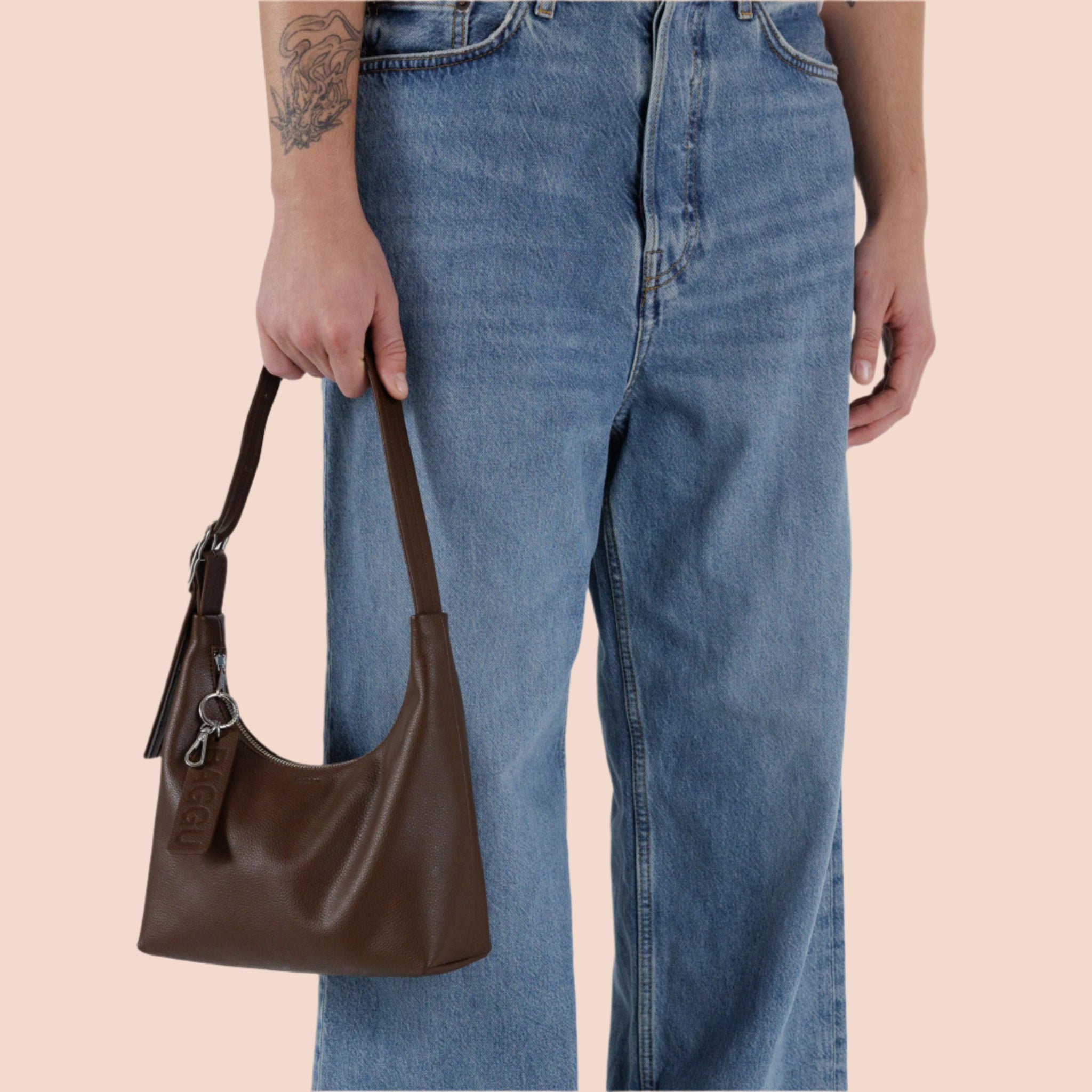 A mini version of the leather shoulder bag in a brown recycled leather. 