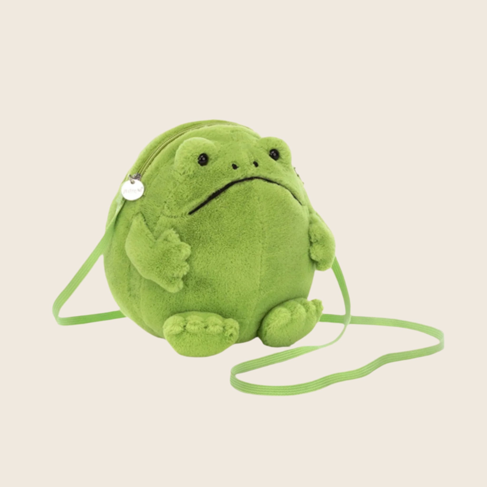 A green frog shaped bag with a crossbody green strap. 