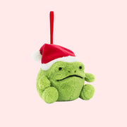 A green frog shaped ornament wearing a red Santa hat. 