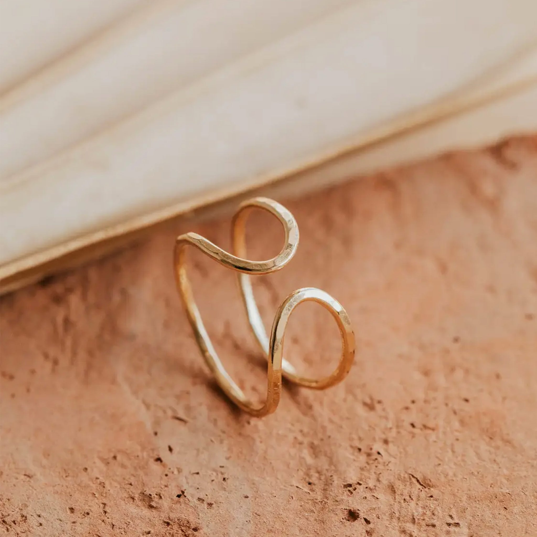 A gold slightly hammered ring. 