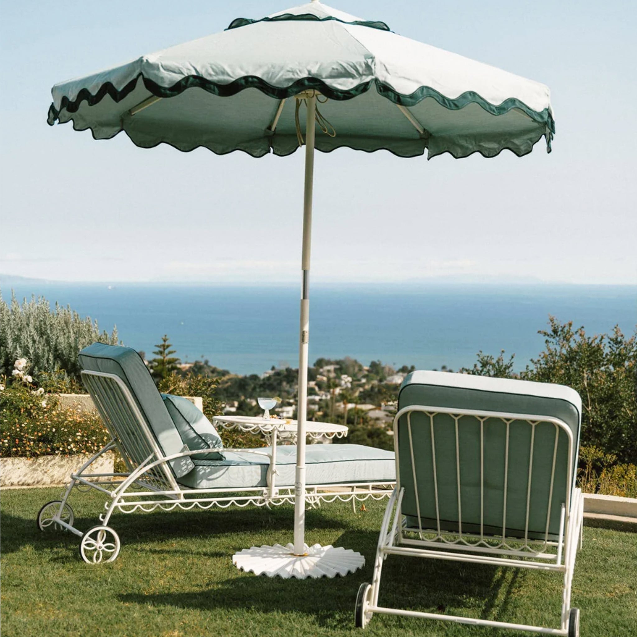 A green and darker green lined umbrella. 