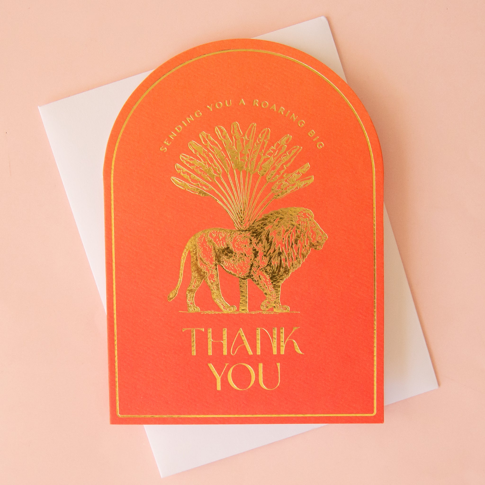 orange card with gold foil illustration of a lion. text reads sending you a roaring big thank you