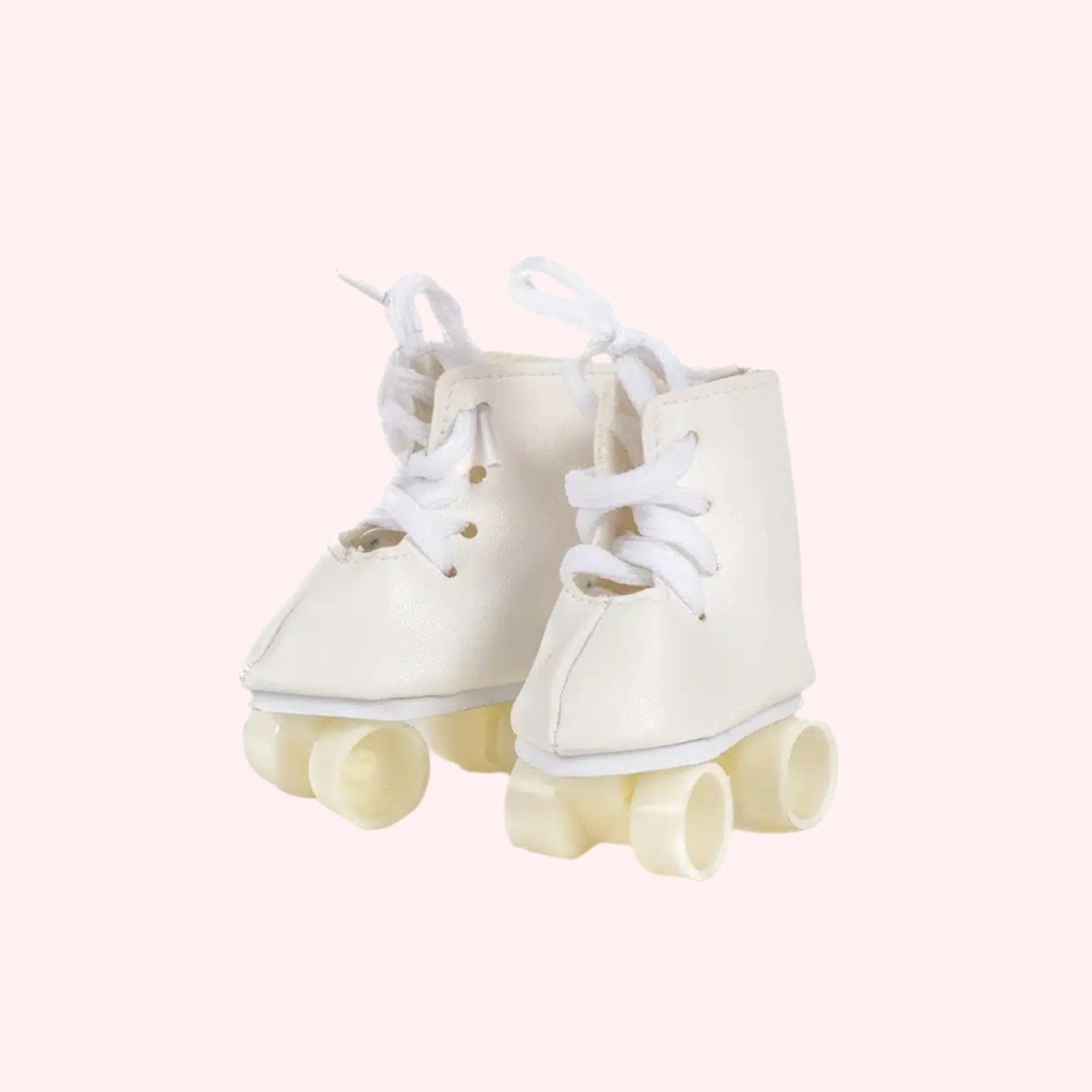 A pair of white roller skates for baby dolls. 