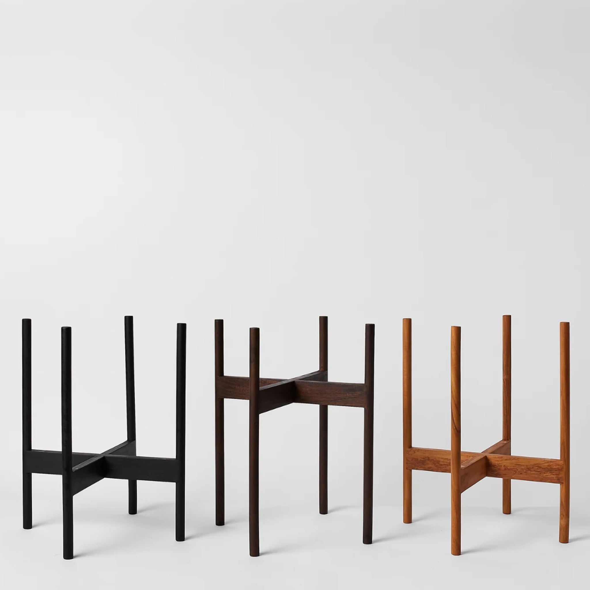 The three color ways of the rounded hardwood stands.