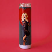 A thin prayer candle with a red heart and a photo of Sabrina Carpenter. 