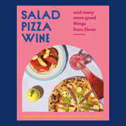 A pink hardback book with blue text on the top left corner that reads, "Salad Pizza Wine", "and many more good things from Elena" along with an arched photo of food on a table scape