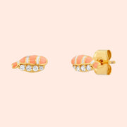 A light orange and white pair of stud earrings shaped as salmon sashimi with cz stones underneath. 