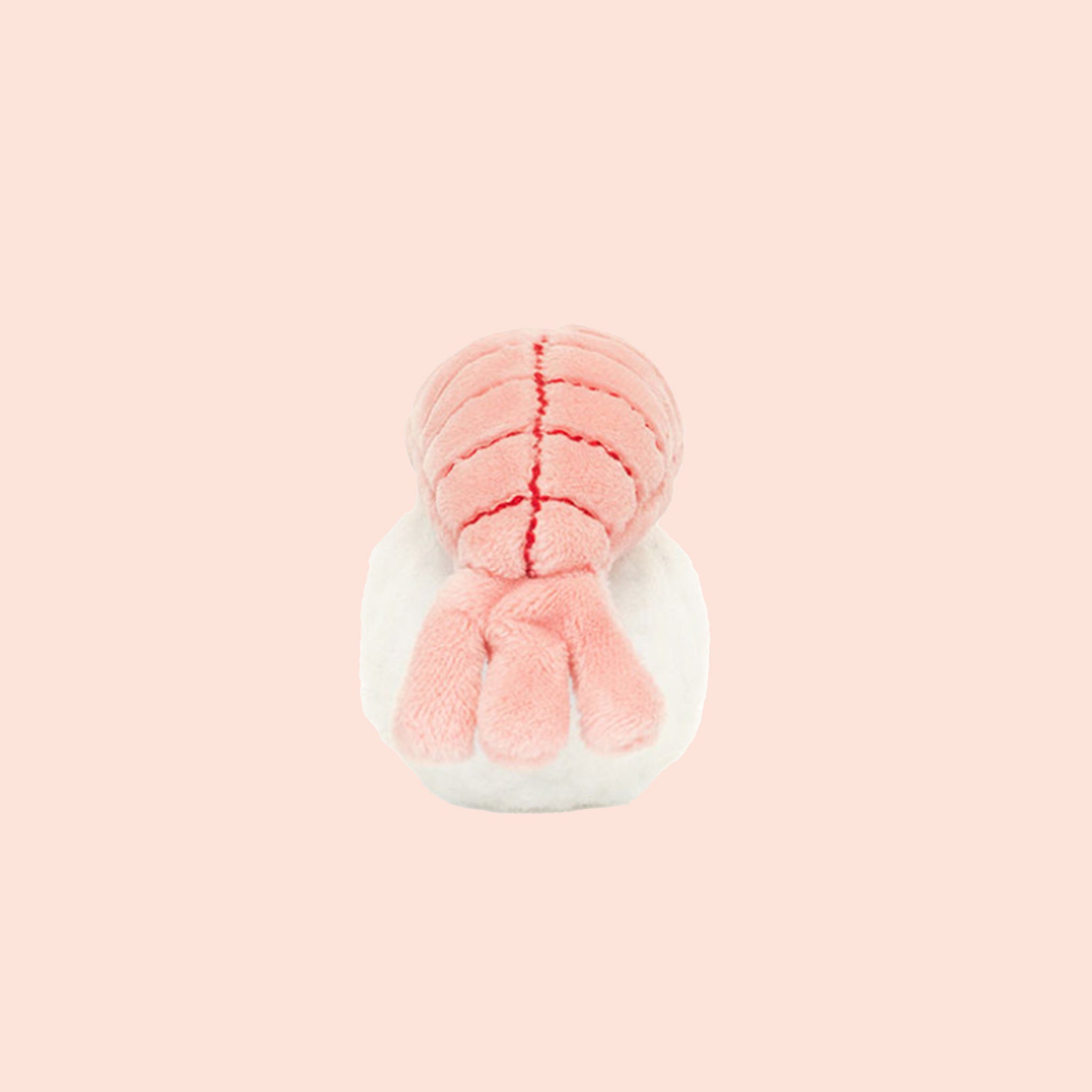 A white and peachy pink sushi shaped stuffed toy.