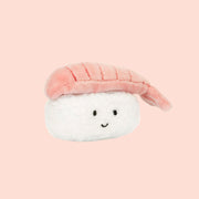 A white and peachy pink sushi shaped stuffed toy. 