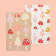 A pair of small notebooks with a toadstool mushroom pattern. 