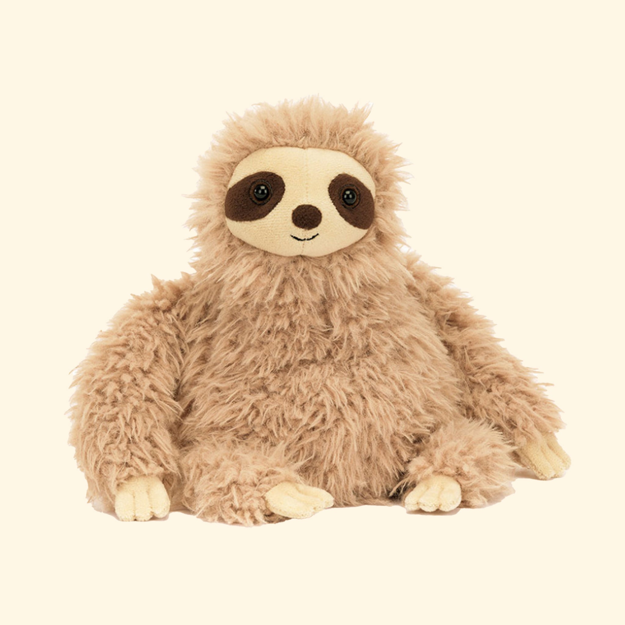 A neutral fuzzy sloth shaped stuffed animal toy. 