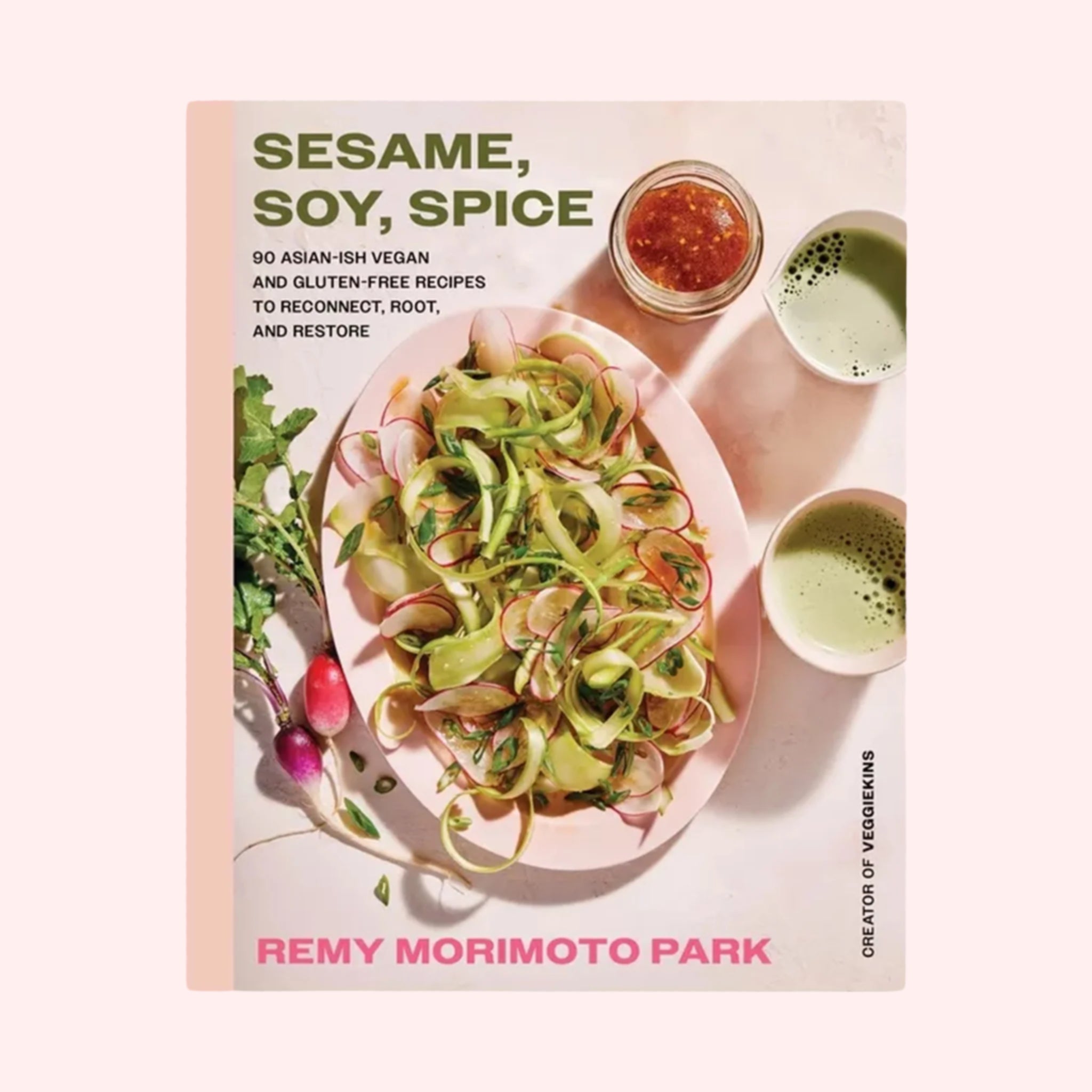 A light pink book with a salad photograph and the title that reads, 'Sesame, Soy, Spice 90 Asian-ish vegan and gluten-free recipes to reconnect, root and restore'. 