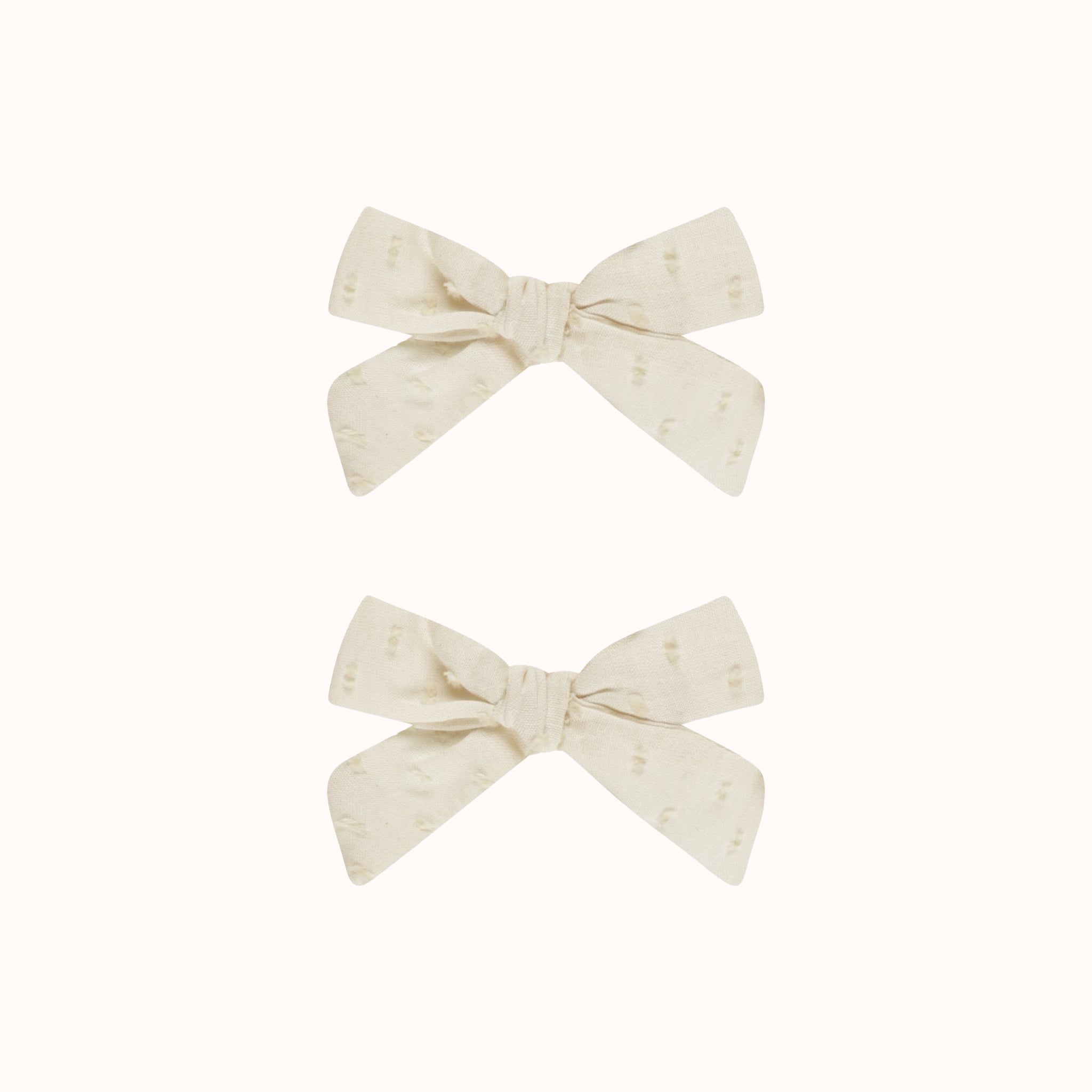 A set of two ivory bows. 