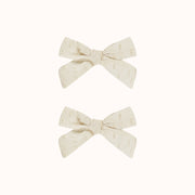 A set of two ivory bows. 