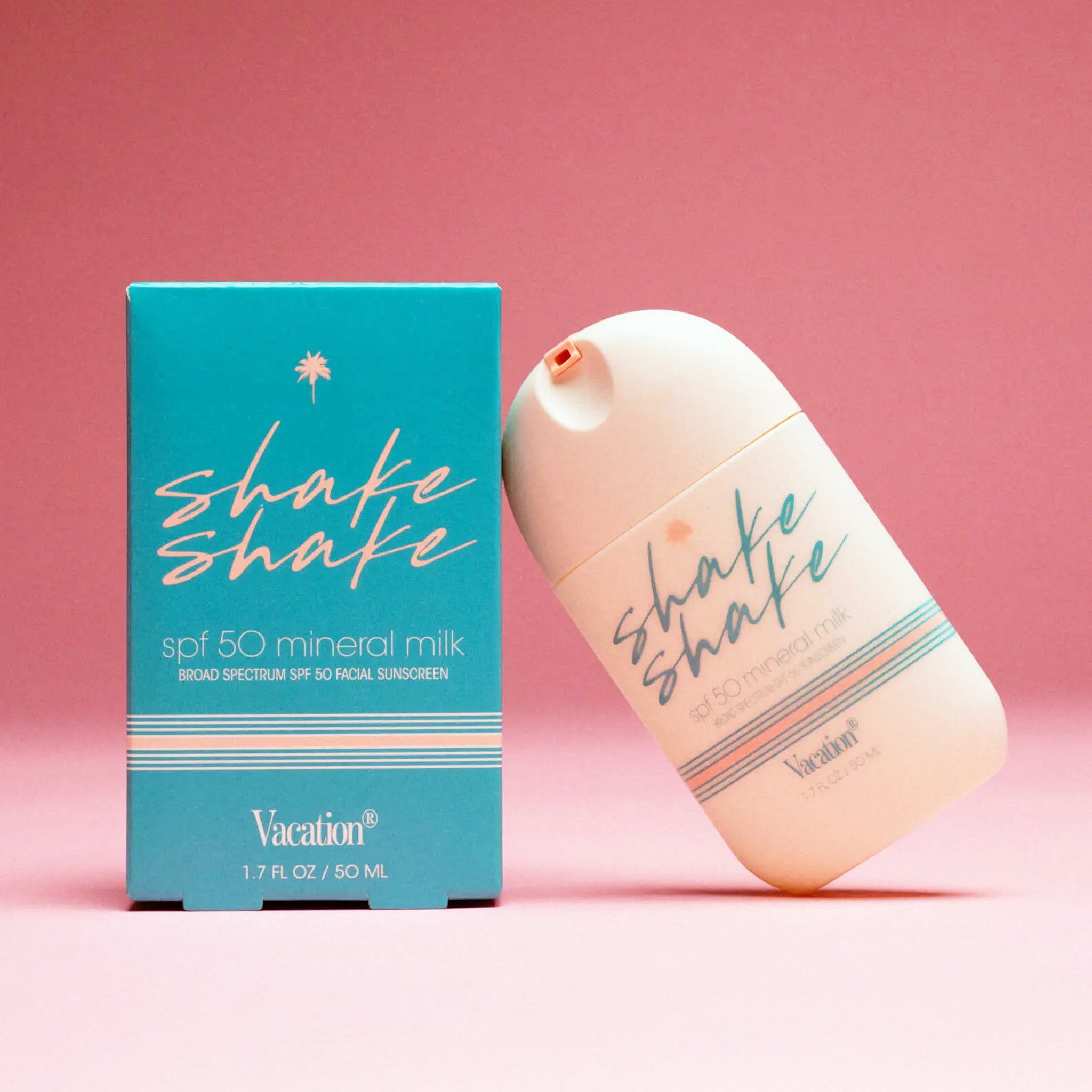 A bottle of SPF with blue text that reads, 'shake shake'. 