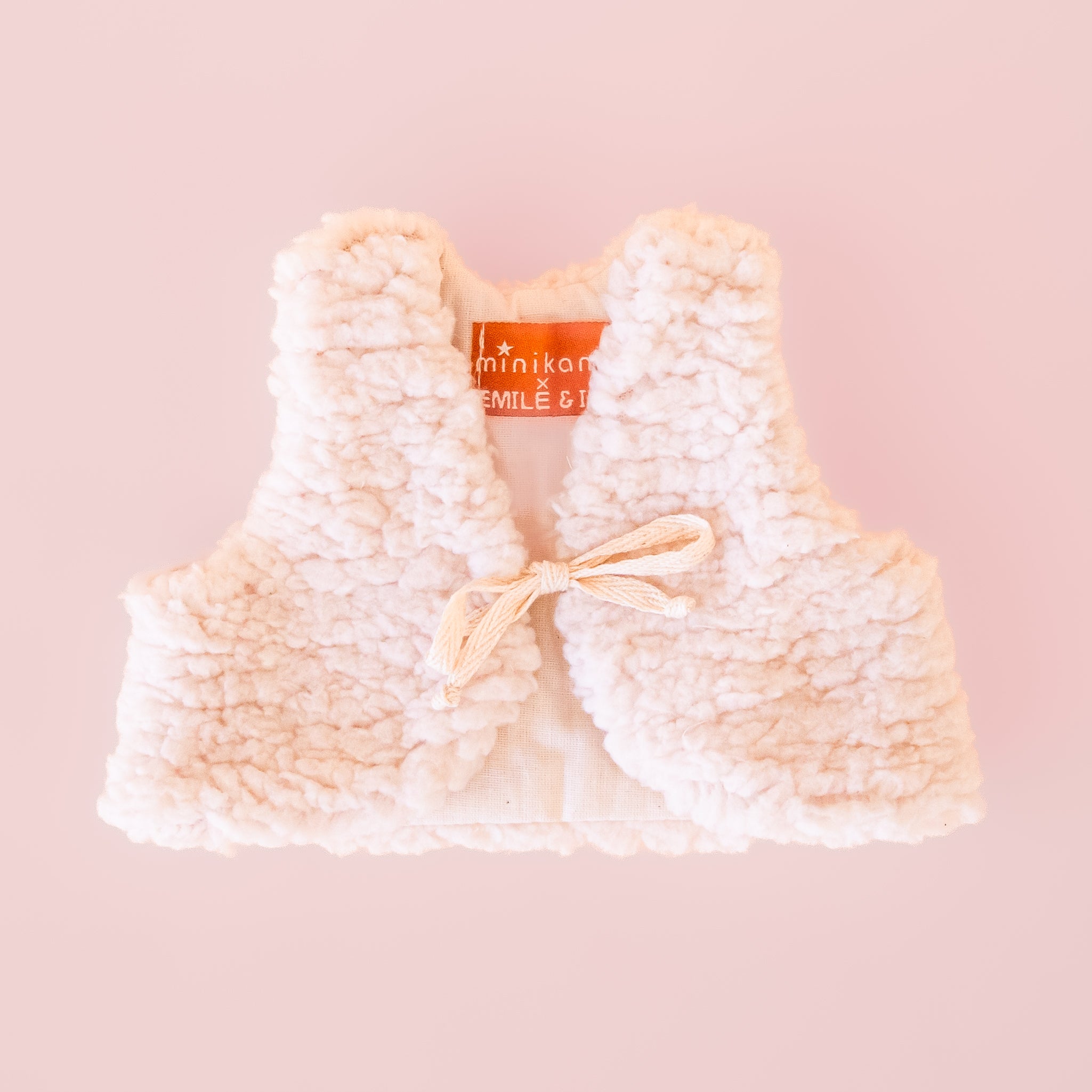 A sherpa vest for a doll. 