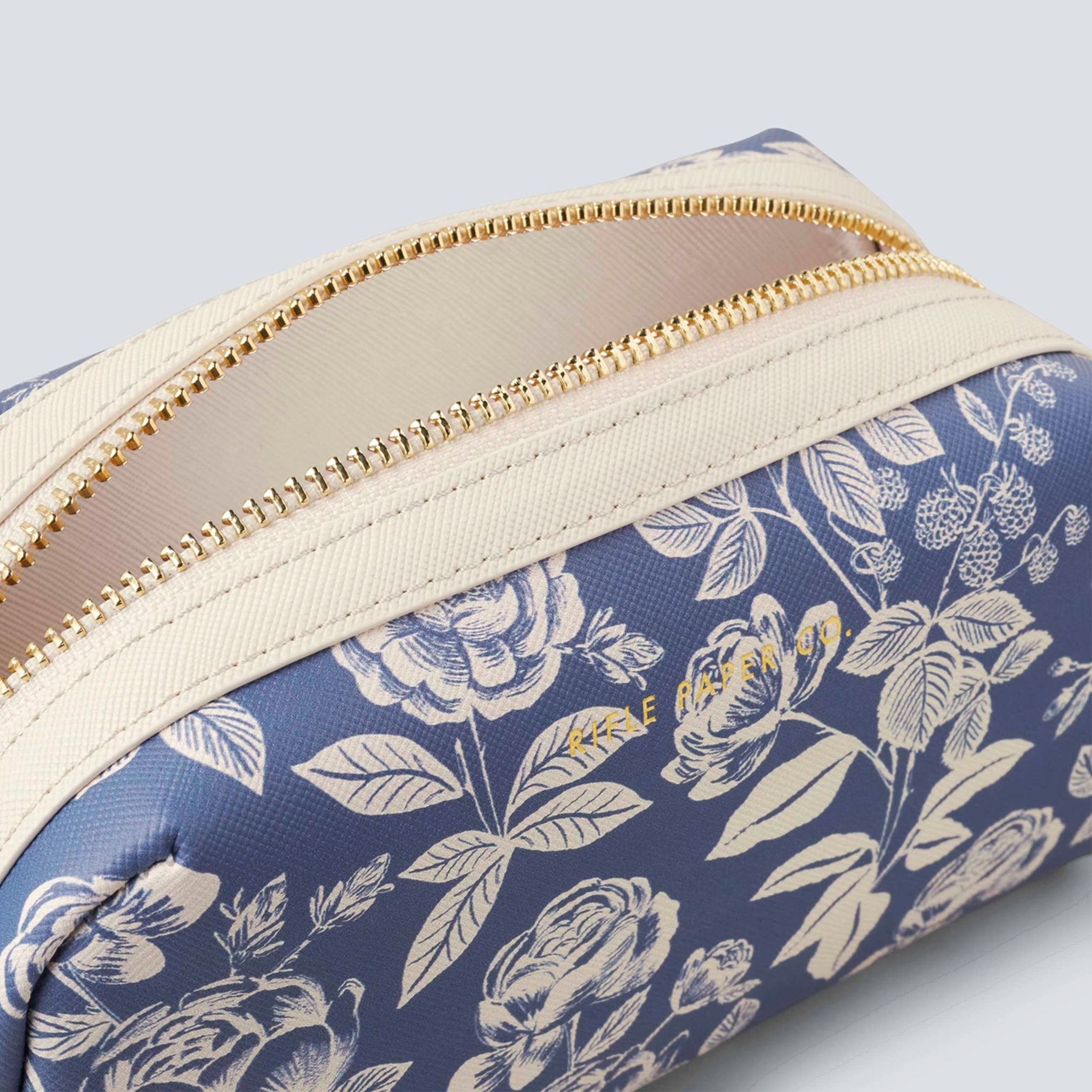 blue cosmetic pouch with white flower pattern