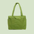 A green puffer carry on tote bag. 