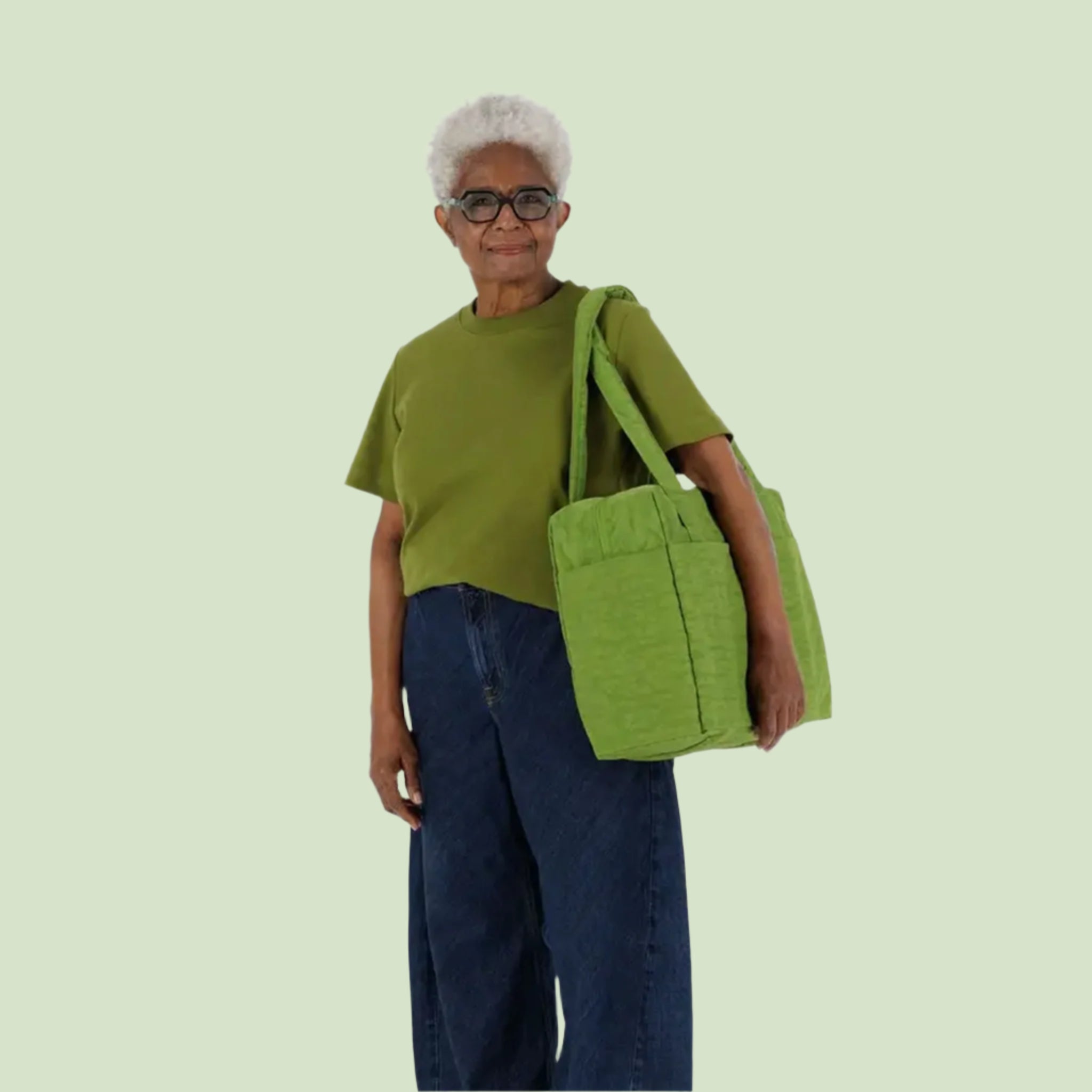 A green puffer carry on tote bag. 