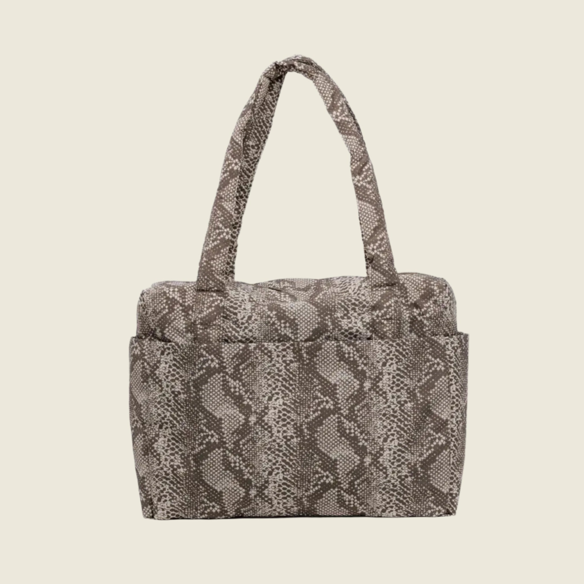 A snakeskin printed nylon cloud carry on. 